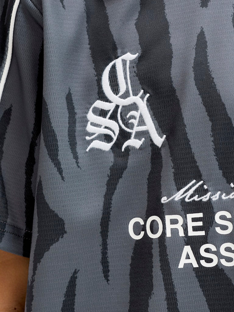 Jcodust Piping Football Open Collar Jnr - Zwart Dessin