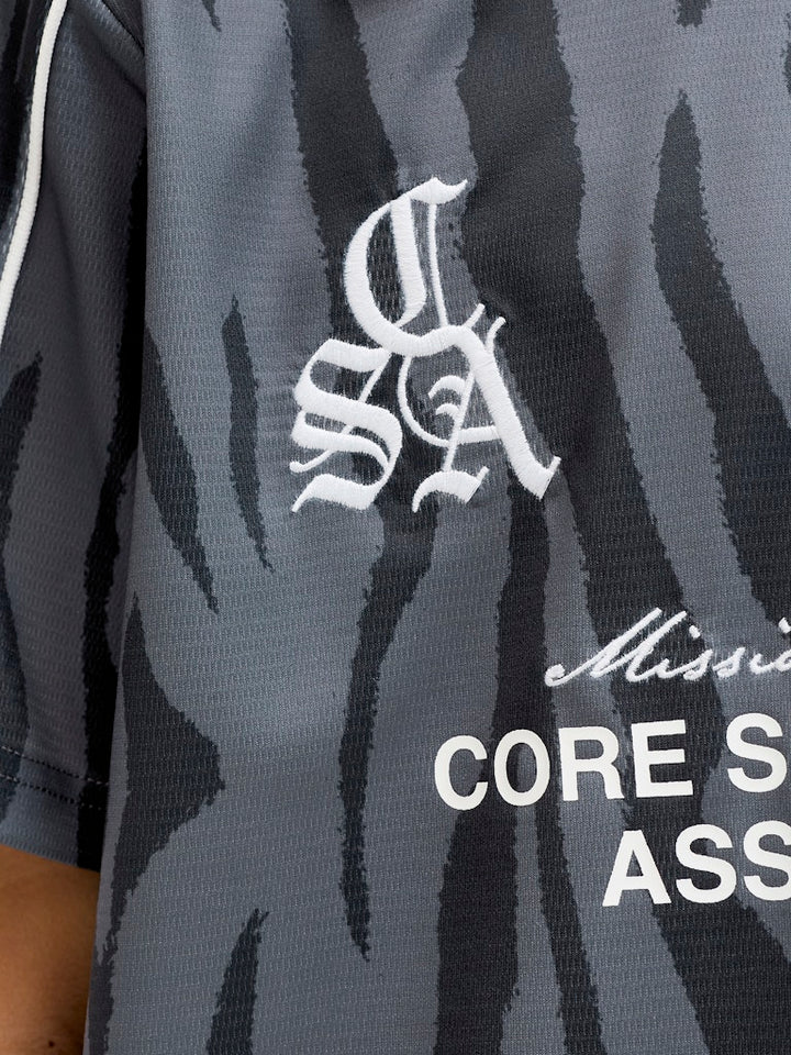 Jcodust Piping Football Open Collar Jnr - Zwart Dessin