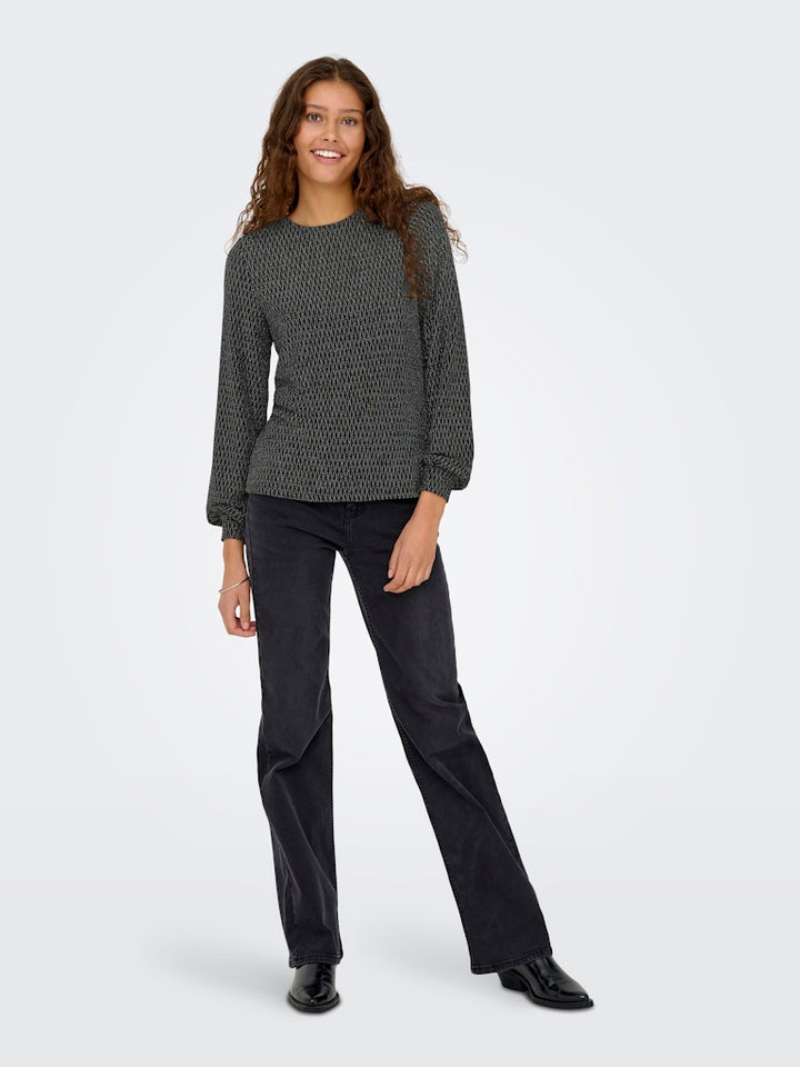 Only ONLCAROL L/S GLITTER BOW TOP BOX JRS – dames blouse - Zwart Dessin